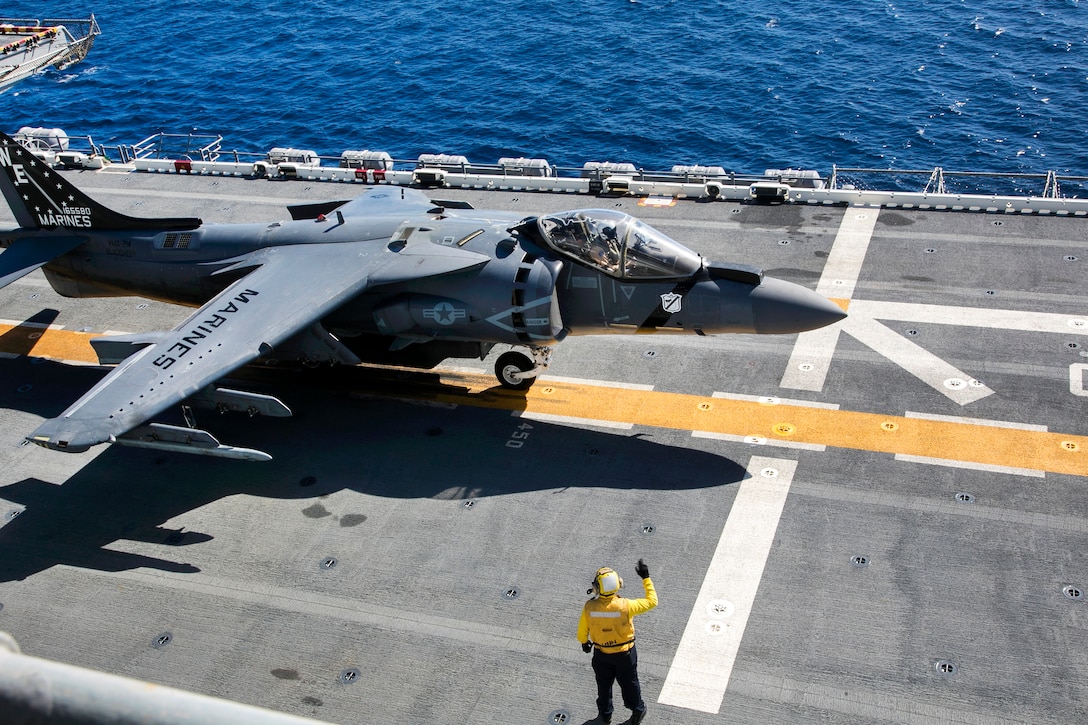 U.S. Marines and sailors prepare an AV-8B Harrier for takeoff during flight operations on the flight deck of the USS Boxer during Integration Training in the Pacific Ocean, Sept. 25, 2015.  U.S. Marine Corps photo by Cpl. Briauna Birl 