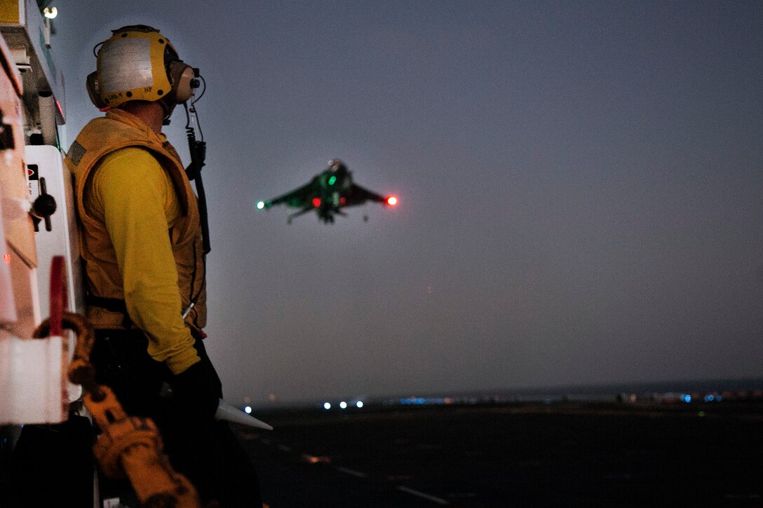 U.S. Marines and sailors conduct night flight operations with AV-8B Harriers on the flight deck of the USS Boxer during integration training in the Pacific Ocean, Sept. 25, 2015. U.S. Marine Corps photo by Cpl. Briauna Birl