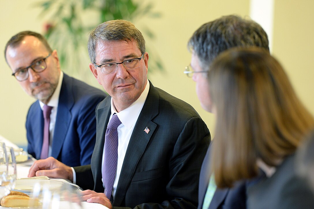 U.S. Defense Secretary Ash Carter speaks with his staff during a working lunch with Spanish Defense Minister Pedro Morenes in Madrid, Oct. 5, 2015. DoD photo by U.S. Army Sgt. 1st Class Clydell Kinchen