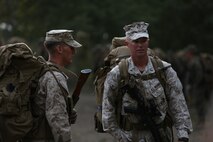Sergeant Nicholas Cordell (left), a topographic intelligence specialist assigned to Communications Company, Headquarters Battalion, 1st Marine Division, speaks with 1st Lt. Alexander Richmond (right), the officer in charge of the exercise, after completing a movement during phase one of Mountain Warfare Training Exercise 5-15 aboard Marine Corps Mountain Warfare Training Center Bridgeport, Calif., Sept. 5, 2015. Phase one of MTNEX required the Marines and Sailors to participate in hands-on instruction which gave them the necessary skills used to conduct the rest of the exercise and to survive the austere, mountainous environment. (U.S. Marine Corps photo by Cpl. Will Perkins/Released)