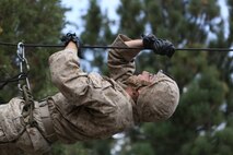 Lance Cpl. Steven Kalifon, a satellite communications operator assigned to Communications Company, 1st Marine Division, conducts a gorge crossing during phase two of Mountain Warfare Training Exercise 5-15 aboard Marine Corps Mountain Warfare Training Center Bridgeport, Calif., Sept. 11, 2015. The training covered maneuvering throughout mountainous terrain features by rope climbing and rappelling as well as surviving in the rugged environment. (U.S. Marine Corps photo by Cpl. Will Perkins/Released)