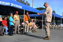 Major Gen. Daniel O’Donohue, commanding general, 1st Marine Division, pays respect to members of the Navajo Nation during a tour with the Navajo Nation and two Navajo Code Talkers aboard Marine Corps Base Camp Pendleton, Calif., Sept. 28, 2015. Navajo Code Talkers were first put into action during World War II in early 1942 to establish an undecipherable code which could be used in combat environments to communicate sensitive information. (U.S. Marine Corps photo by Cpl. Demetrius Morgan/RELEASED)