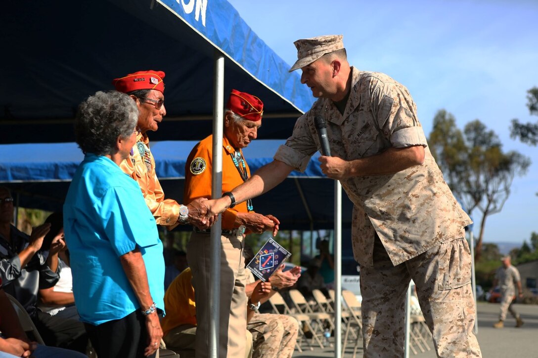 Major General Daniel O’Donohue, commanding general, 1st Marine Division, pays respect to Sam Holiday, a retired Navajo Code Talker, during a tour with the Navajo Nation aboard Marine Corps Base Camp Pendleton, Calif., Sept. 28, 2015. Navajo Code Talkers were first put into action during World War II in early 1942 to establish an undecipherable code which could be used in combat environments to communicate sensitive information. (U.S. Marine Corps photo by Cpl. Demetrius Morgan/RELEASED)