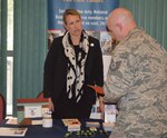 Amy Nevells, New York Military One Source consultant, talks with an Airman with the 109th Airlift Wing who will be deploying in support of Operation Deep Freeze about services available to him and his family during the first-ever White Ribbon event at Stratton Air National Guard Base, New York, on Oct. 3, 2015. The White Ribbon is very similar to the Yellow Ribbon events offered to those affected by contingency deployments. 
