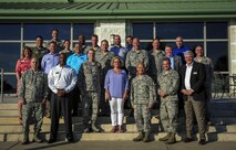 Hurlburt Field commanders and honorary commanders stand for a photo during the honorary commanders change of command ceremony on Hurlburt Field, Fla., Sept. 25, 2015. The honorary commander program allows local community leaders frequent opportunities to visit Hurlburt Field and learn about the mission, participate in base functions and to express their views on issues of mutual concern. (U.S. Air Force photo by Senior Airman Meagan Schutter)
