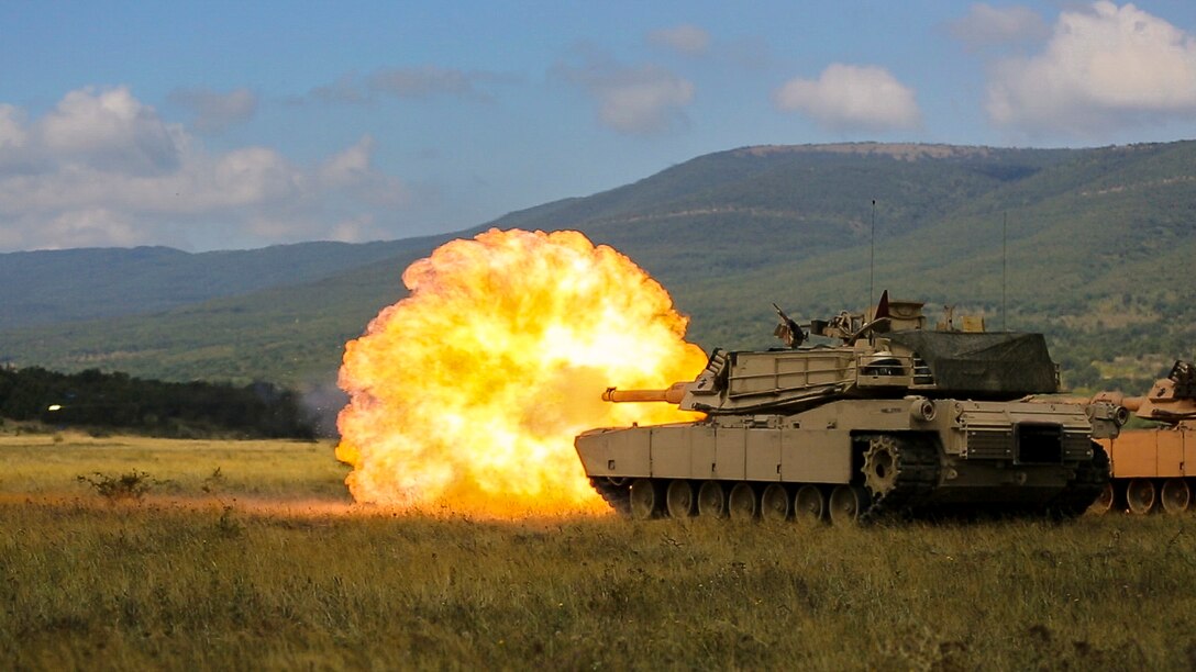U.S. Marines with Combined Arms Company fire an M1A1 Abrams tank during a field training exercise at Novo Selo Training Area, Bulgaria, Sept. 21, 2015. The Marines underwent several days in the field to prepare for multinational training exercises over the next few months.