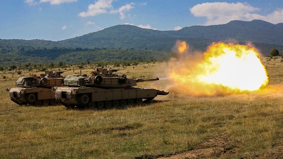 U.S. Marines with Combined Arms Company fire an M1A1 Abrams tank during a field training exercise at Novo Selo Training Area, Bulgaria, Sept. 21, 2015. The Marines underwent several days in the field to prepare for multinational training exercises over the next few months. 