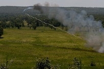 U.S. Army Reserve Soldiers with the 364th Engineer Company (Sapper) fired two inert M58 Mine Clearing Line Charges, rocket-projected line charges usually used to clear mines, during River Assault at Fort Chaffee, Ark., July 29. (U.S. Army photo by Staff Sgt. Debralee Best)