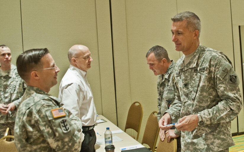 Col. Gregg Hadlock, (front, right) and Col. Scott Chambers, (behind, right) answer questions during a break-out session concerning domestic operations at the Engineer Total Army Planning Exercise conference.
