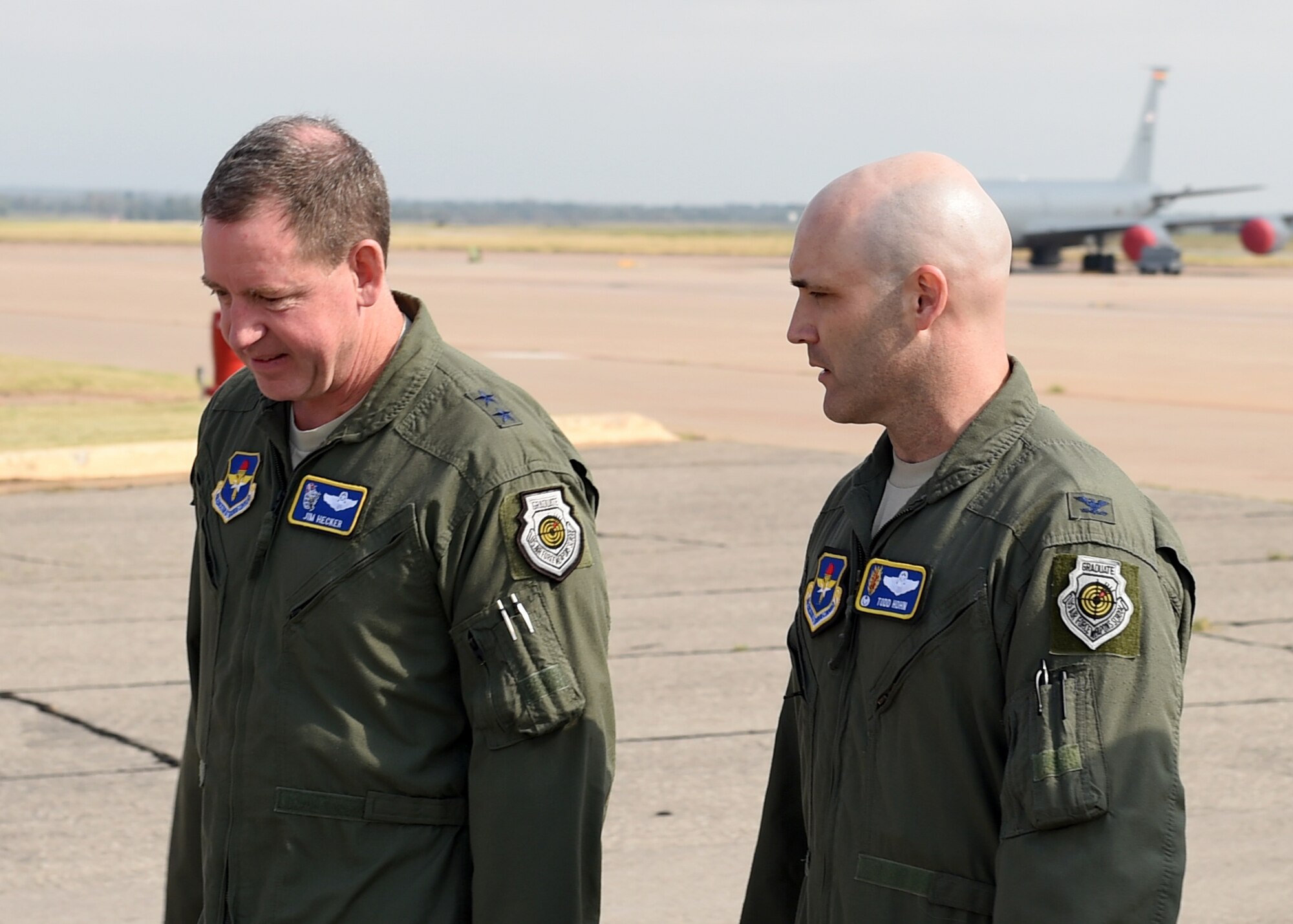 U.S. Air Force Maj. Gen. James Hecker, 19th Air Force commander, talks to U.S. Air Force Col. Todd Hohn, 97th Air Mobility Wing commander on the flightline, Oct. 1, 2015. Hecker visited the 97th AMW as part of his familiarization tour to have a better understanding of all the wings within the 19th Air Force. (U.S. Air Force photo by Airman 1st Class Kirby Turbak/Released)