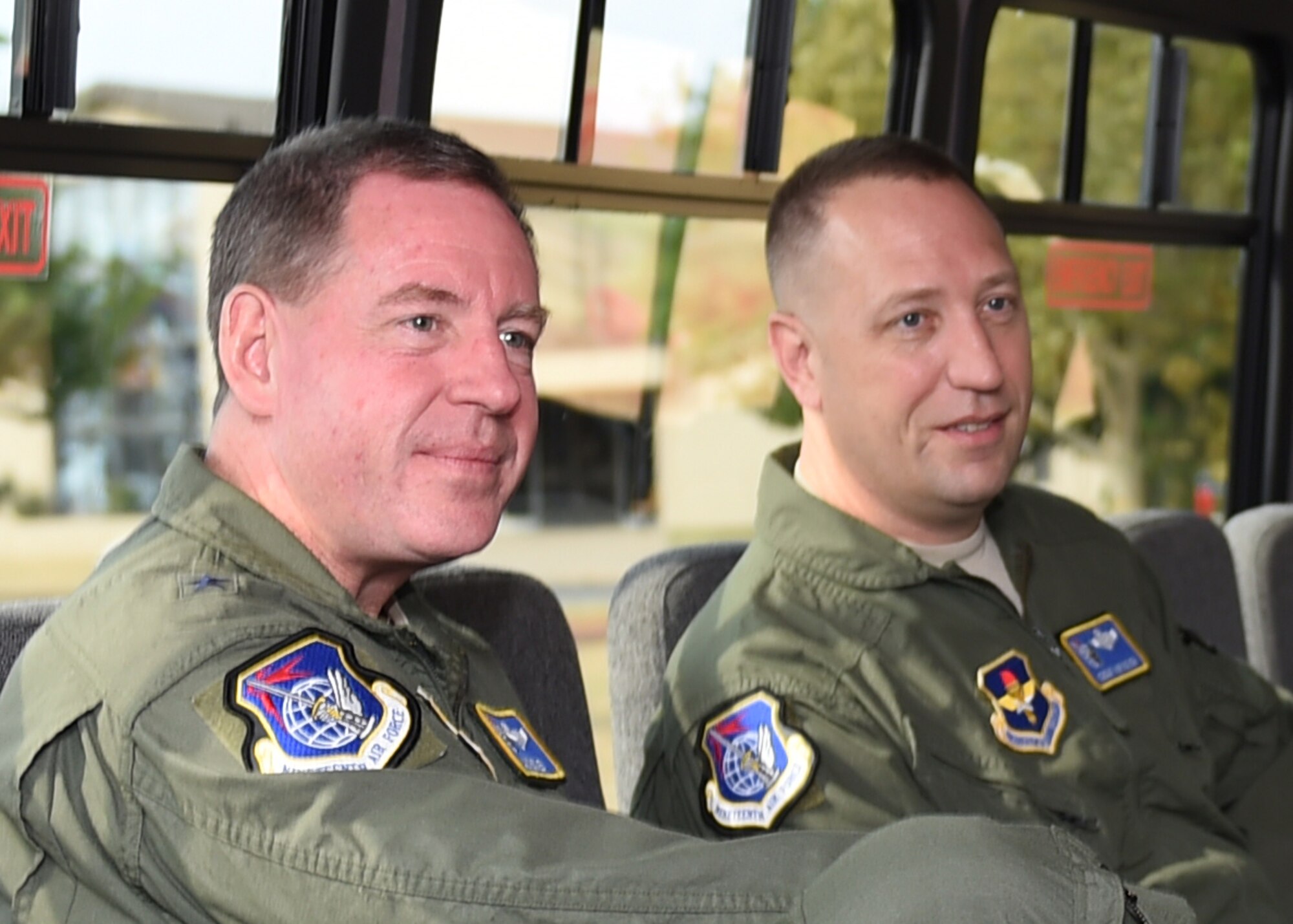 U.S. Air Force Maj. Gen. James Hecker, 19th Air Force commander, and Chief Master Sgt. Robert Boyer, 19th Air Force command chief, talk with leadership of Altus AFB, Oct. 1, 2015. Hecker visited the 97th Air Mobility Wing as part of his familiarization tour to have a better understanding of all the wings within the 19th Air Force.  (U.S. Air Force photo by Airman 1st Class Kirby Turbak/Released)