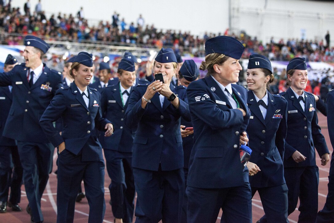 U.S. Air Force athletes and members of the U.S. Armed Forces team march into the stadium before the start of the 2015 6th Conseil International du Sport Militaire (CISM) World Games opening ceremony, where athletes from over 100 nations joined together in Mungyeong, South Korea, Oct. 2, 2015. U.S. Marine Corps photo by Cpl. Jordan Gilbert