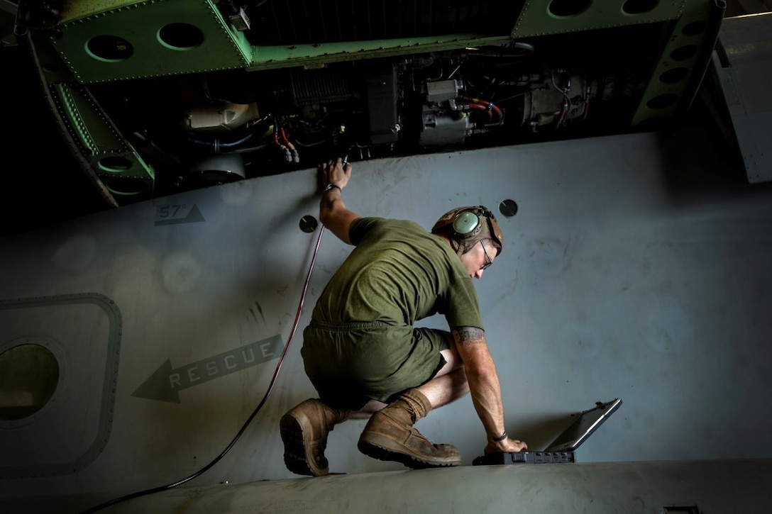 ARABIAN GULF (Oct. 3, 2015) A U.S. Marine with Medium Marine Tiltrotor Squadron 161 (Reinforced), 15th Marine Expeditionary Unit, checks the functions on an MV-22B Osprey undergoing maintenance aboard the amphibious assault ship USS Essex (LHD 2). The 15th MEU, embarked aboard the ships of the Essex Amphibious Ready Group, is deployed to maintain regional security in the U.S. 5th Fleet area of operations. (U.S. Marine Corps photo by Cpl. Elize McKelvey/Released)