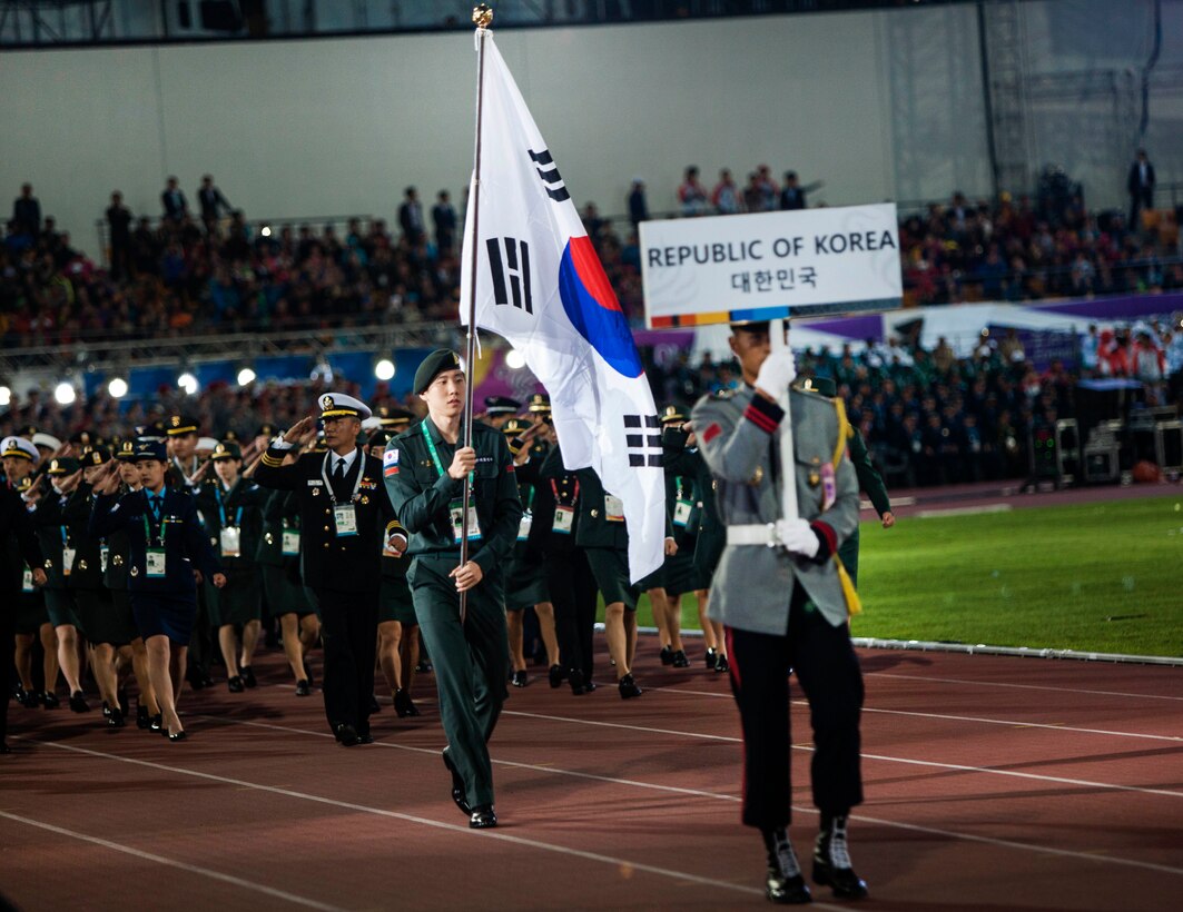 South Korean team members march into the stadium before the start of the 2015 6th Conseil International du Sport Militaire (CISM) World Games opening ceremony, where athletes of over 100 nations joined together in Mungyeong, South Korea, Oct. 2, 2015. U.S. Marine Corps photo by Sgt. Ashley Cano