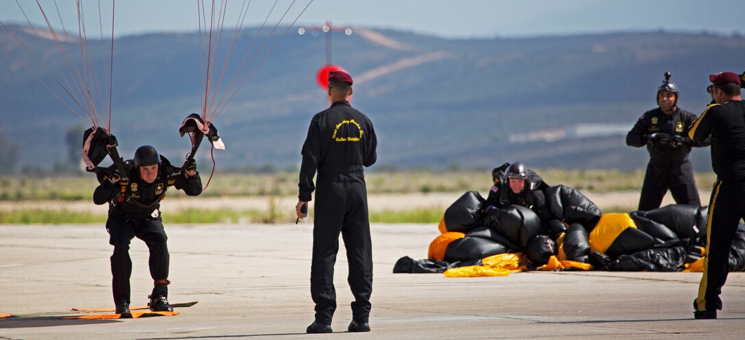 The Army’s Golden Knights parachute team land safely during their performance at the 2015 Miramar Air Show aboard Marine Corps Air Station Miramar, California, Oct. 3. The two-person teams consist of active duty men and women from all military occupational specialties. (U.S. photo by Sgt. Uriel Avendano/Released)