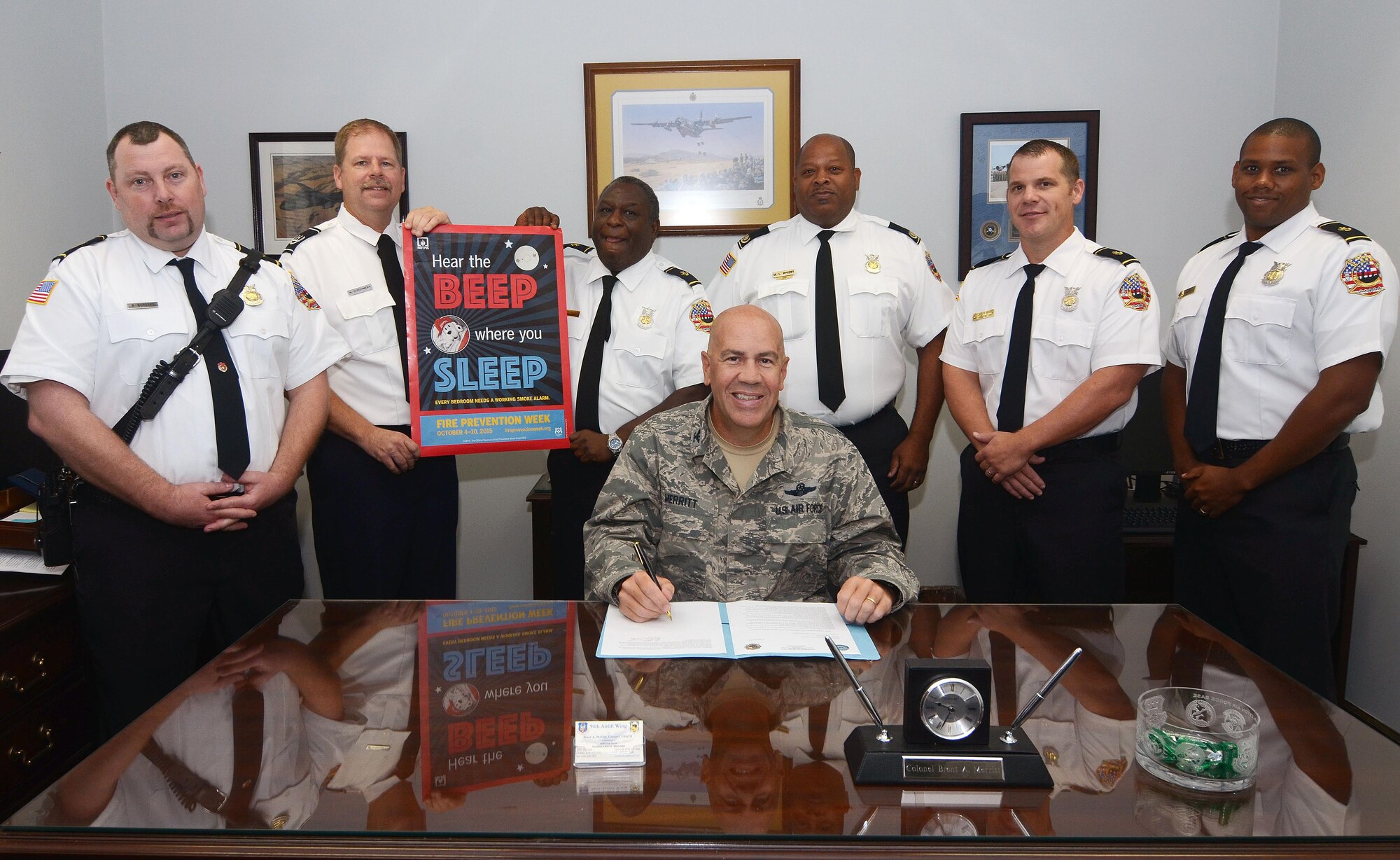 Col. Brent Merritt, 94th Airlift Wing commander, signs a proclamation for Dobbins Fire Prevention Week 2015, Oct. 2, 2015, at Dobbins Air Reserve Base, Ga. This year’s theme is “Hear the Beep where you sleep, every bedroom needs a working smoke alarm”. Fire Prevention Week lasts from Oct. 4 through 10 Oct. (U.S. Air Force photo by Don Peek/Released)