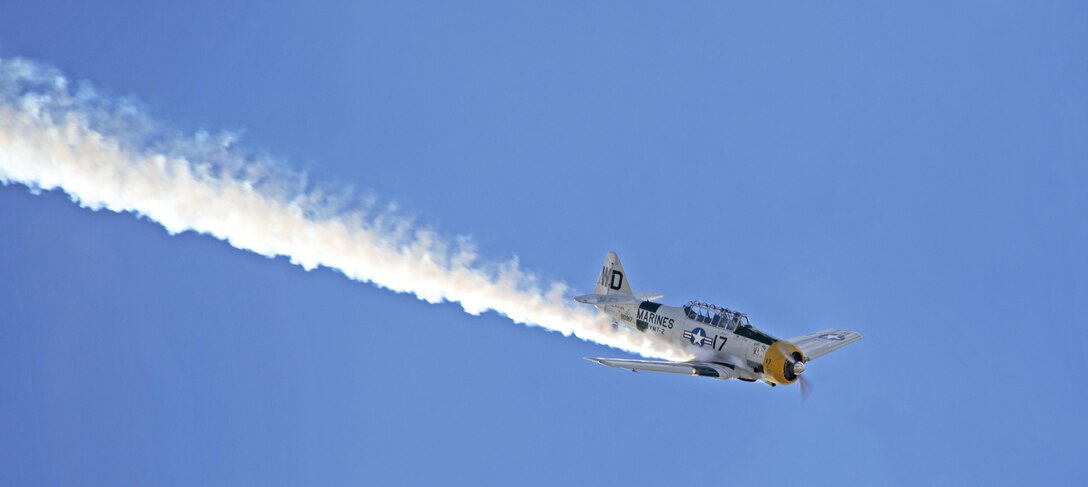 A North American AT-6 Wardog flew over crowds during a performance aboard Marine Corps Air Station Miramar, Calif., Oct. 2. The Wardog performed a series of aerobatic maneuvers during the 2015 MCAS Miramar Air Show. (U.S. Marine Corps photo by Sgt. Uriel Avendano/Released)