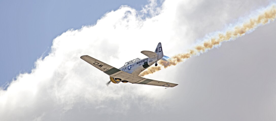 A North American AT-6 Wardog flew over crowds during a performance aboard Marine Corps Air Station Miramar, Calif., Oct. 2. The Wardog performed a series of aerobatic maneuvers during the 2015 MCAS Miramar Air Show. (U.S. Marine Corps photo by Sgt. Uriel Avendano/Released)