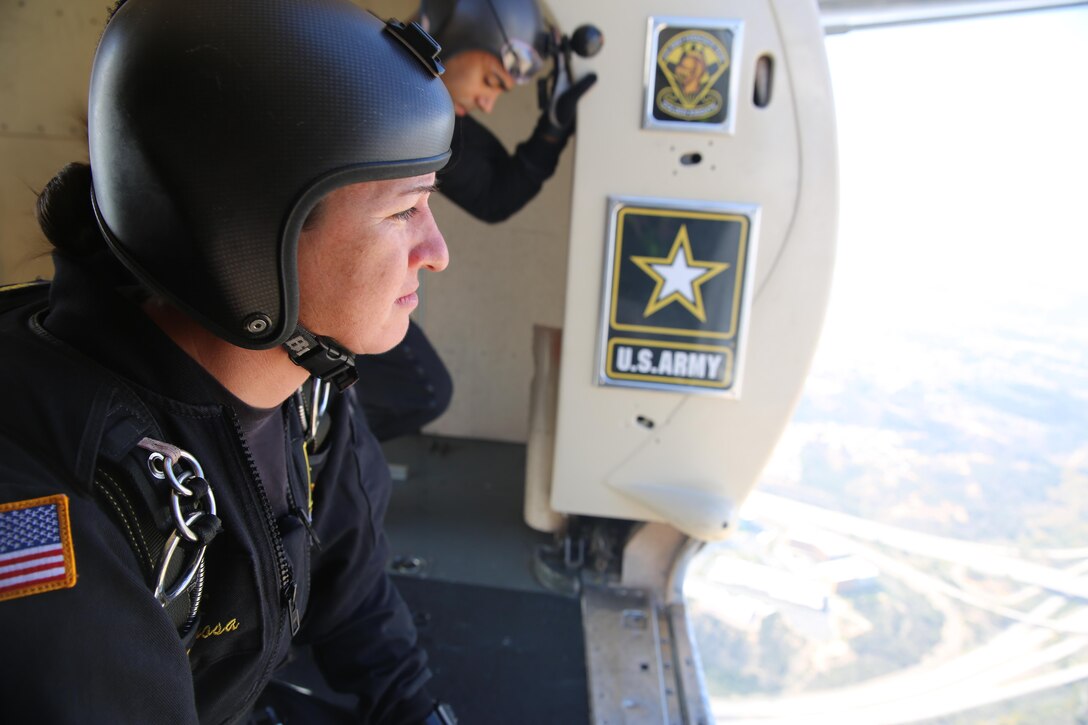 A member of the Army’s Golden Knights parachute team prepares to jump during the 2015 MCAS Miramar Air Show aboard Marine Corps Air Station Miramar, Calif., Oct. 3. The demonstration team jumps from at least 12,000 feet to the target center on the ground and consists of active duty soldiers. (U.S. Marine Corps photo by Cpl. Alissa P. Schuning/Released)