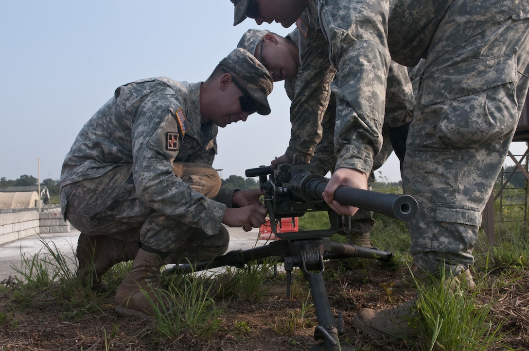 U.S. Army Reserve combat engineers with the 688th Engineer Company (Mobility Augmentation) out of Harrison, Ark., remove an M2 .50-caliber machine gun from its tripod for a relay during Sapper Stakes 2015 at Fort Chaffee, Ark., Aug. 31. (U.S. Army photo by Staff Sgt. Debralee Best)