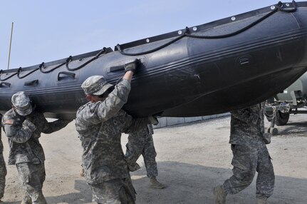 U.S. Army Reserve Soldiers with the 391st Engineer Company out of Boise, Idaho, compete in Sapper Stakes 2015 in a timed Zodiac boat carry at Fort Chaffee, Ark., Aug. 31. (U.S. Army photo by Staff Sgt. Debralee Best)