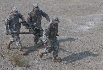 U.S. Army Reserve combat engineers from the 680th Engineer Company out of Webster, N.Y., run while carrying an M2 .50-caliber machine gun during a relay at Sapper Stakes 2015 in Fort Chaffee, Ark., Aug. 31. (U.S. Army photo by Staff Sgt. Debralee Best)