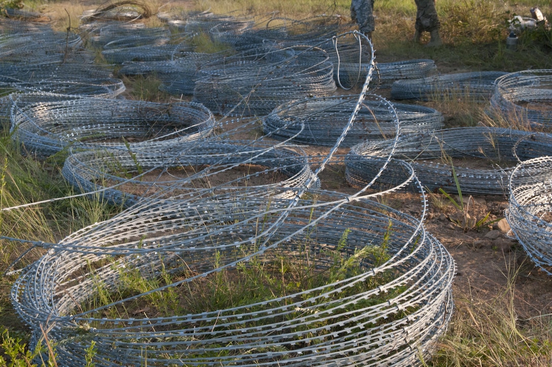 U.S. Army Reserve and National Guard Sapper Stakes 2015 competitors emplaced a hasty frat fence using concertina wire and pickets as part of the competition at Fort Chaffee, Ark., Sept. 1. (U.S. Army photo by Staff Sgt. Debralee Best)