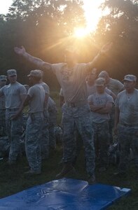 U.S. Army Reserve Sgt. Matthew Heinle, combat engineer, 455th Engineer Company out of Hayden Lake, Idaho, brings his hands together to clap during a burpee during Sapper Stakes 2015 at Fort Chaffee, Ark., Aug. 30. Teams were required to complete a combined total of 500 burpees during the nonstandard Army physical fitness test, the first event of the competition. (U.S. Army photo by Staff Sgt. Debralee Best)