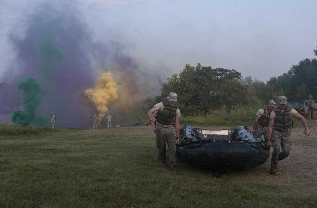 Soldiers competing in Sapper Stakes 2015 return a Zodiac boat to the start point after rowing across Engineer Lake at Fort Chaffee, Ark., as part of the nonstandard Army physical fitness test, Aug. 30. (U.S. Army photo by Staff Sgt. Debralee Best)