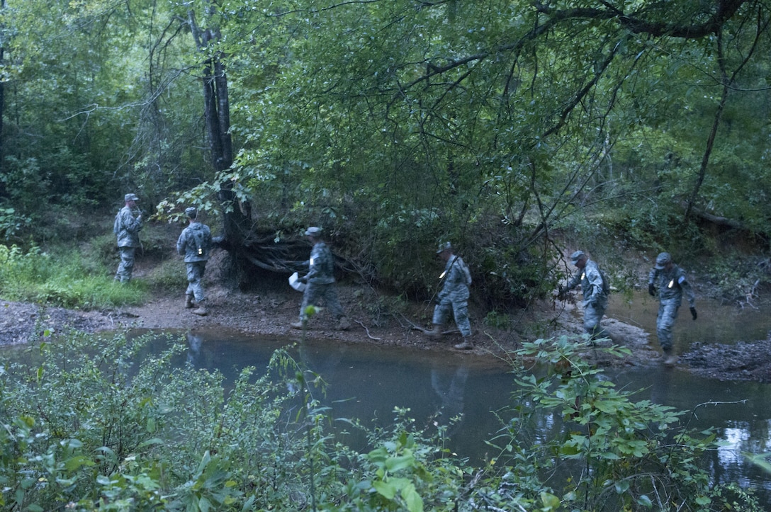 U.S. Army Reserve Soldier from the 680th Engineer Company out of Webster, N.Y., finds their first point during a land navigation event at Sapper Stakes 2015 at Fort Chaffee, Ark., Aug. 30. Teams found a total of eight points, performing 100 pushups as a team between every two points. (U.S. Army photo by Staff Sgt. Debralee Best)