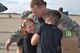 Capt. Craig Van Praag, 931st Aircraft Maintenance Squadron OIC, greets his children after returning from a deployment to Southwest Asia, Oct. 4, 2015, at McConnell Air Force Base, Kan. Van Praag returned along with 19 other Reservists. (U.S. Air Force photo by Tech. Sgt. Abigail Klein)