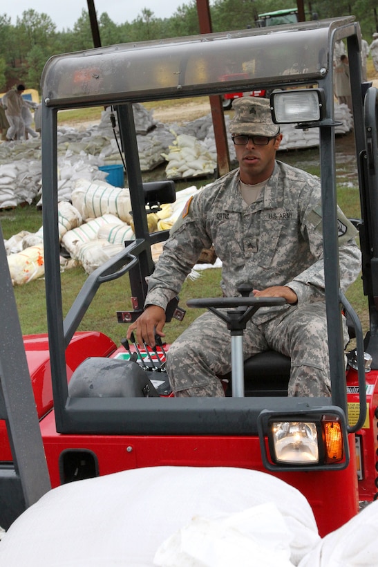 Army Sgt. Jerry Ortiz loads one of many sandbag pallets onto an awaiting truck at the Wateree Correctional Facility in preparation of Hurricane Joaquin in Rembert, S.C., Oct. 3, 2015. Ortiz is assigned to the South Carolina Army National Guard's 1052th Transportation Company. South Carolina Army National Guard photo by Sgt. Brad Mincey