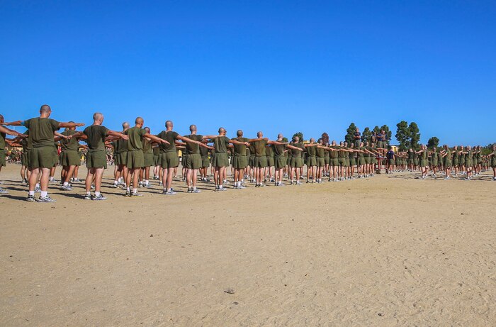 Recruits of Mike Company, 3rd Recruit training Battalion, stretch after maneuvering through the Circuit Course at Marine Corps Recruit Depot San Diego, Sept. 29. The stretches were led by the recruits’ chief drill instructor and are an important part of the cool down phase of training. Today, all males west of the Mississippi are trained at MCRD San Diego. The depot is responsible for training more than 16,000 recruits annually. Mike Company is scheduled to graduate Dec. 11.