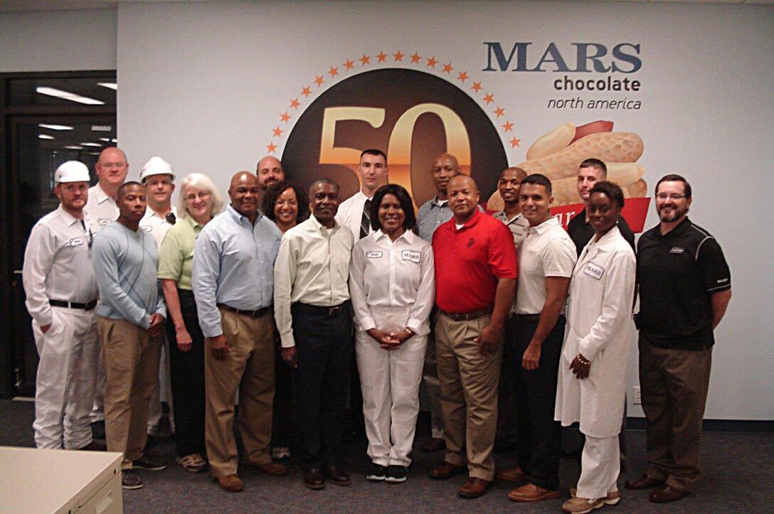 Col. James C. Carroll III, commanding officer, Marine Corps Logistics Base Albany, along with several Marines, Sailors and Civilian-Marines, toured the Mars Chocolate North America Albany, Ga., site, Oct. 1.  The visit was part of his familiarization tour with the community and local industry. "I had no idea the huge impact the local plant has on worldwide operations as it relates to the diverse product line that includes both human and pet foods. The innovation that is taking place here in Albany was an eye-opener and I was amazed to learn that all of the peanuts that go into Mars products around the world come from right here," Carroll said.