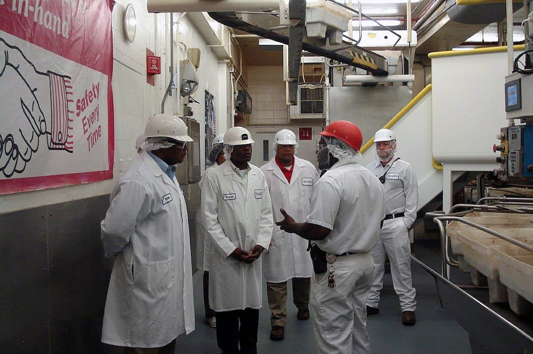 Col. James C. Carroll III, commanding officer, Marine Corps Logistics Base Albany, along with several Marines, Sailors and Civilian-Marines, toured the Mars Chocolate North America Albany, Ga., site, Oct. 1. The visit was part of his familiarization tour with the community and local industry. "I had no idea the huge impact the local plant has on worldwide operations as it relates to the diverse product line that includes both human and pet foods. The innovation that is taking place here in Albany was an eye-opener and I was amazed to learn that all of the peanuts that go into Mars products around the world come from right here," Carroll said.