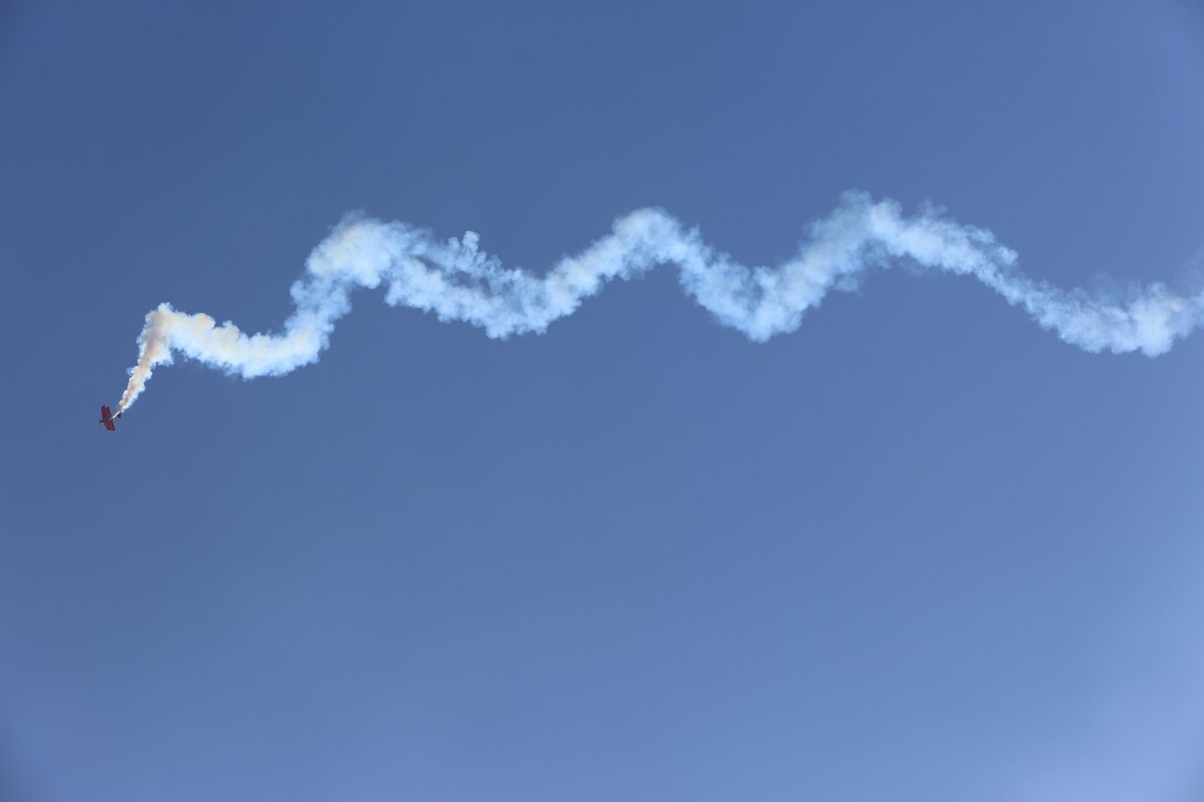 The Oracle Challenger performs a one-of-a-kind aerobatic flight during the 2015 MCAS Miramar Air Show aboard Marine Corps Air Station Miramar, Calif., Oct. 3. Sean Tucker, the pilot of the Oracle, has flown in more than 1,000 performances around the country. (U.S. Marine Corps Photo by Lance Cpl. Kimberlyn Adams/Released)