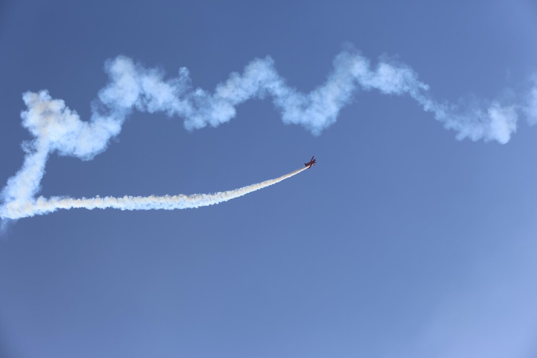 The “Oracle Challenger,” piloted by Sean D. Tucker, dives through the air during the 2015 MCAS Miramar Air Show aboard Marine Corps Air Station Miramar, Calif., Oct. 3.Tucker performed aerobatic stunts for the crowd gathered at the largest military air show in the nation. (U.S. Marine Corps Photo by Lance Cpl. Kimberlyn Adams/Released)