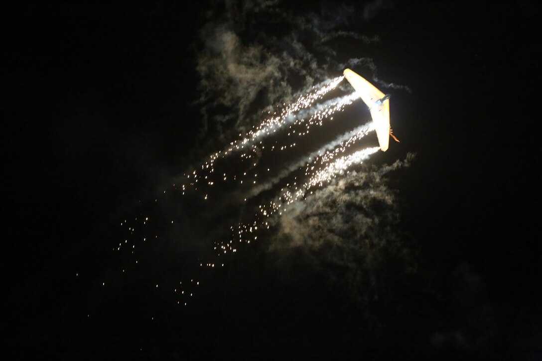 Dan Buchanan pilots an illuminated hang glider during his performance at the 2015 MCAS Miramar Air Show aboard Marine Corps Air Station Miramar, Calif., Oct. 3. Buchanan has accrued more than 2,400 hours of flight time in hang gliders. (U.S. Marine Corps photo by Lance Cpl. Kimberlyn Adams/Released)