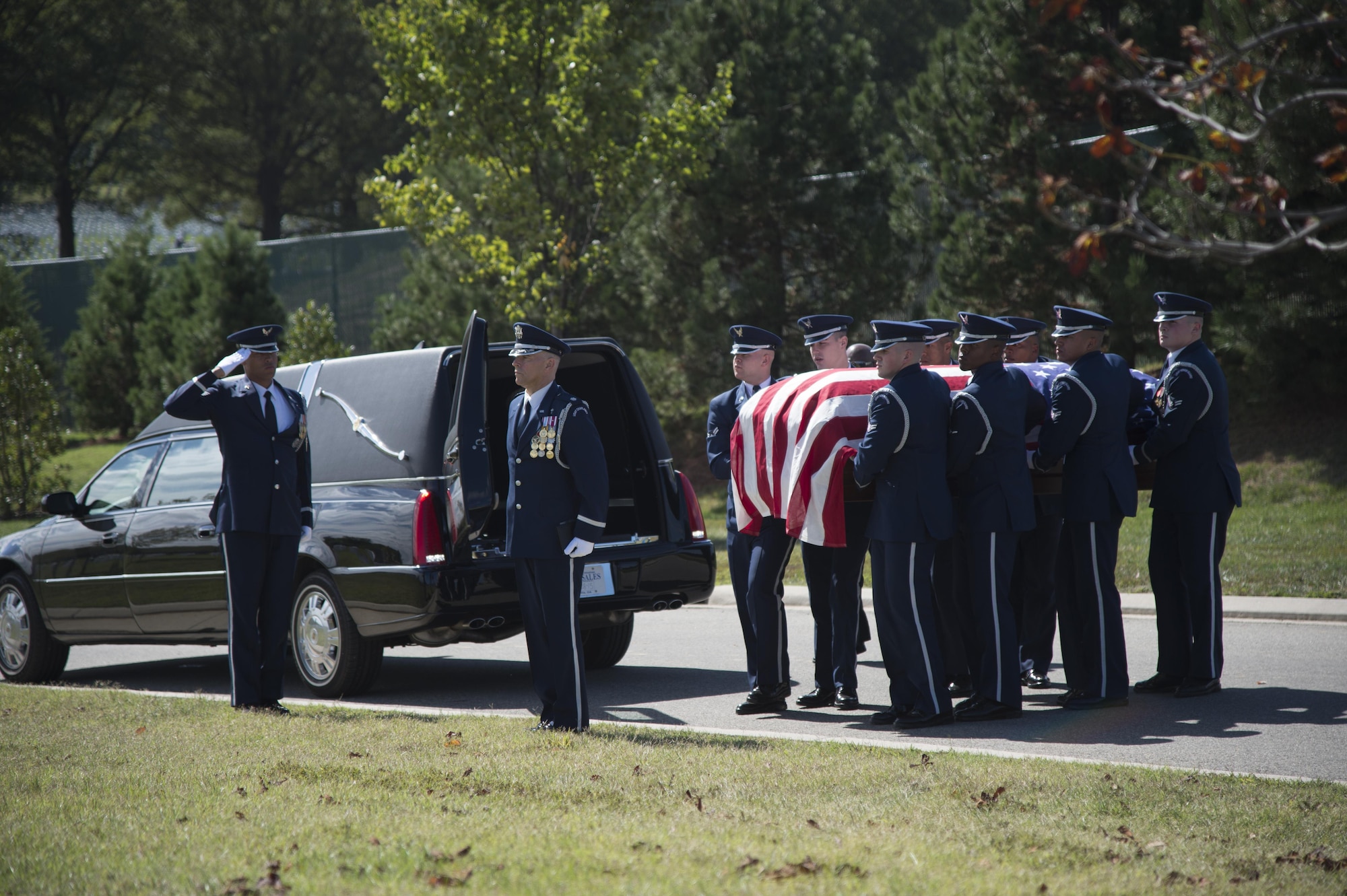 U.S. Air Force Honor Guard pallbearers carry the remains of Tech Sgt. Timothy Officer to his final resting place at Arlington National Cemetery, Va. , Oct. 5, 2015. (U.S. Air Force photo/ Airman 1st Class J.D. Maidens/released)