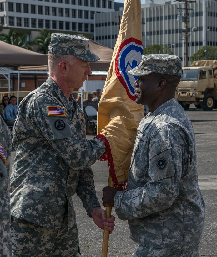 Brig. Gen. David Elwell, 311th Expeditionary Sustainment Command commanding general, passed the guidon to Command Sgt. Maj. Grady Blue Jr., 311th ESC incoming command sergeant major, in a change of responsibility ceremony at the West Los Angeles U.S. Army Reserve Center March 22.