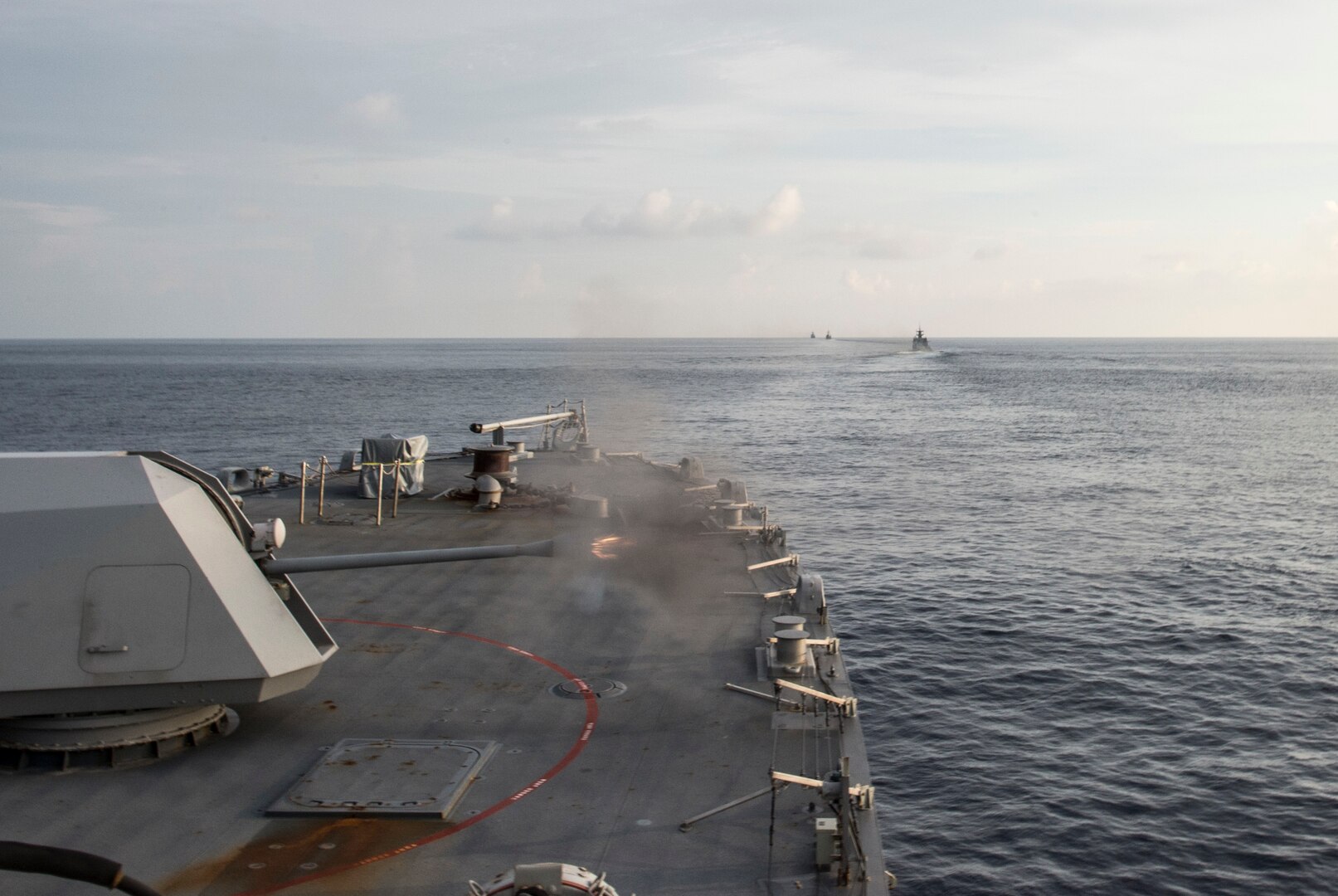 151001-N-MK881-887
BAY OF BENGAL (October 1, 2015) The littoral combat ship USS Fort Worth (LCS 3) fires at a target during a gun exercise with the Bangladesh Navy during Cooperation Afloat Readiness and Training (CARAT) Bangladesh 2015. CARAT is an annual, bilateral exercise series with the U.S. Navy, U.S. Marine Corps and the armed forces of nine partner nations. (U.S. Navy photo by Mass Communication Specialist 2nd Class Joe Bishop/Released)