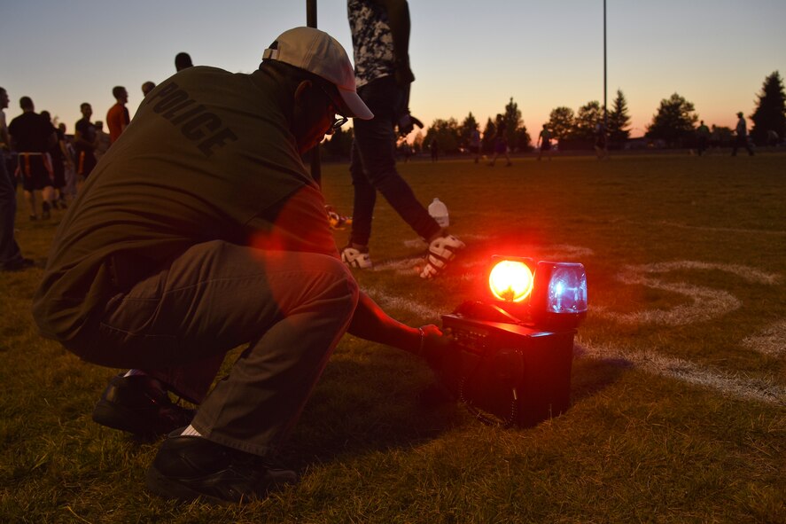 Master Sgt. Henry Strozier, 92nd Security Forces Squadron first sergeant, celebrates a touchdown by turning on the lights and sirens during the intramural flag football championship game Sept. 30, 2015, at Fairchild Air Force Base, Wash. The 92nd SFS competed against the 92nd Civil Engineer Squadron and the 92nd Aircraft Maintenance Squadron during the playoffs, then defeated Survival, Evasion, Resistance and Escape specialists in the championship game 35 to 21. (U.S. Air Force photo/Airman 1st Class Mackenzie Richardson)