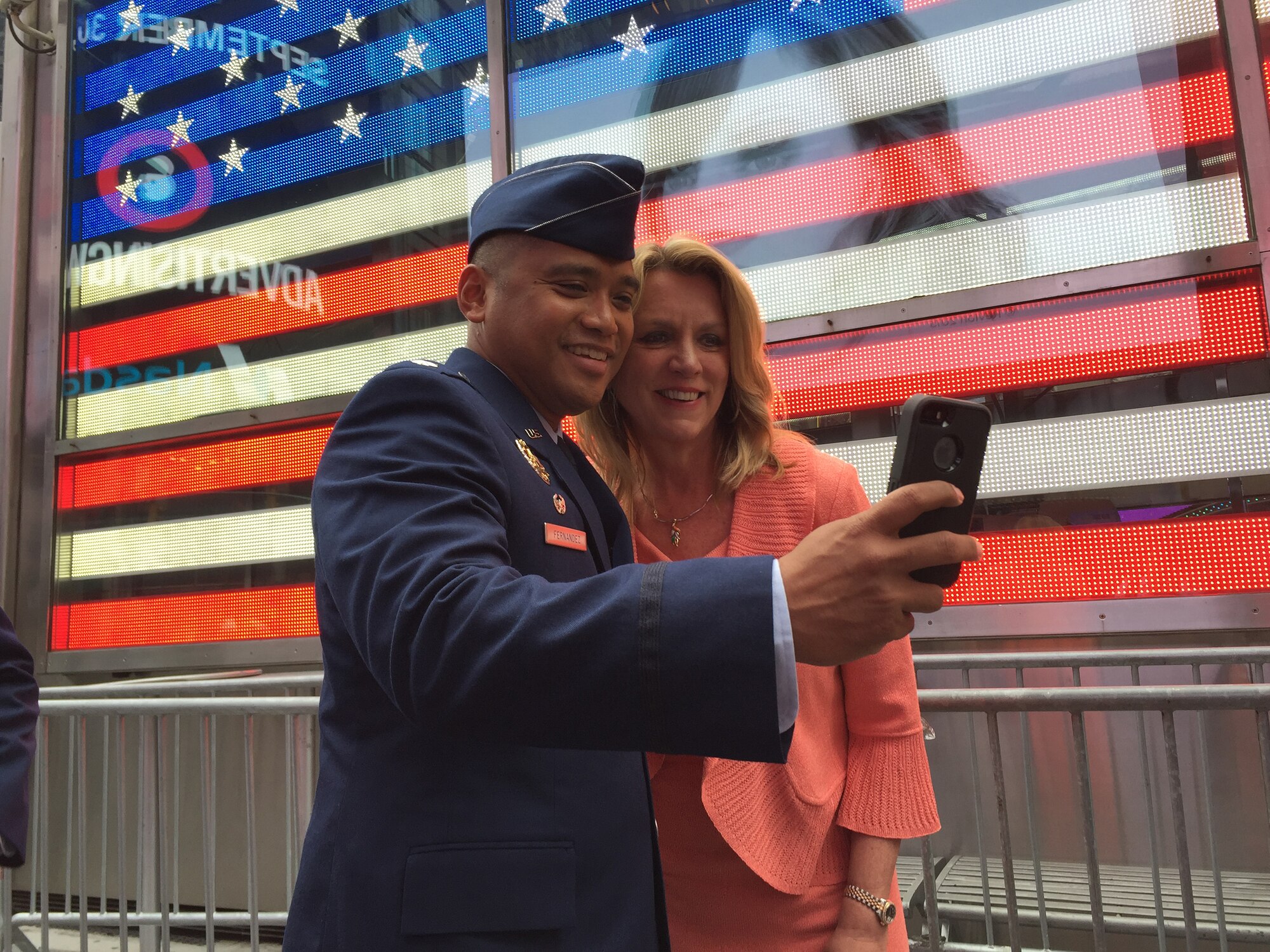 Lt. Col. Ray J. Fernandez, commander of the 313th Recruiting Squadron, takes a selfie with Secretary of the Air Force Deborah Lee James in front of the Times Square office in New York City Sept. 30, 2015. (U.S. Air Force photo/Master Sgt. Jennifer Lindsey)