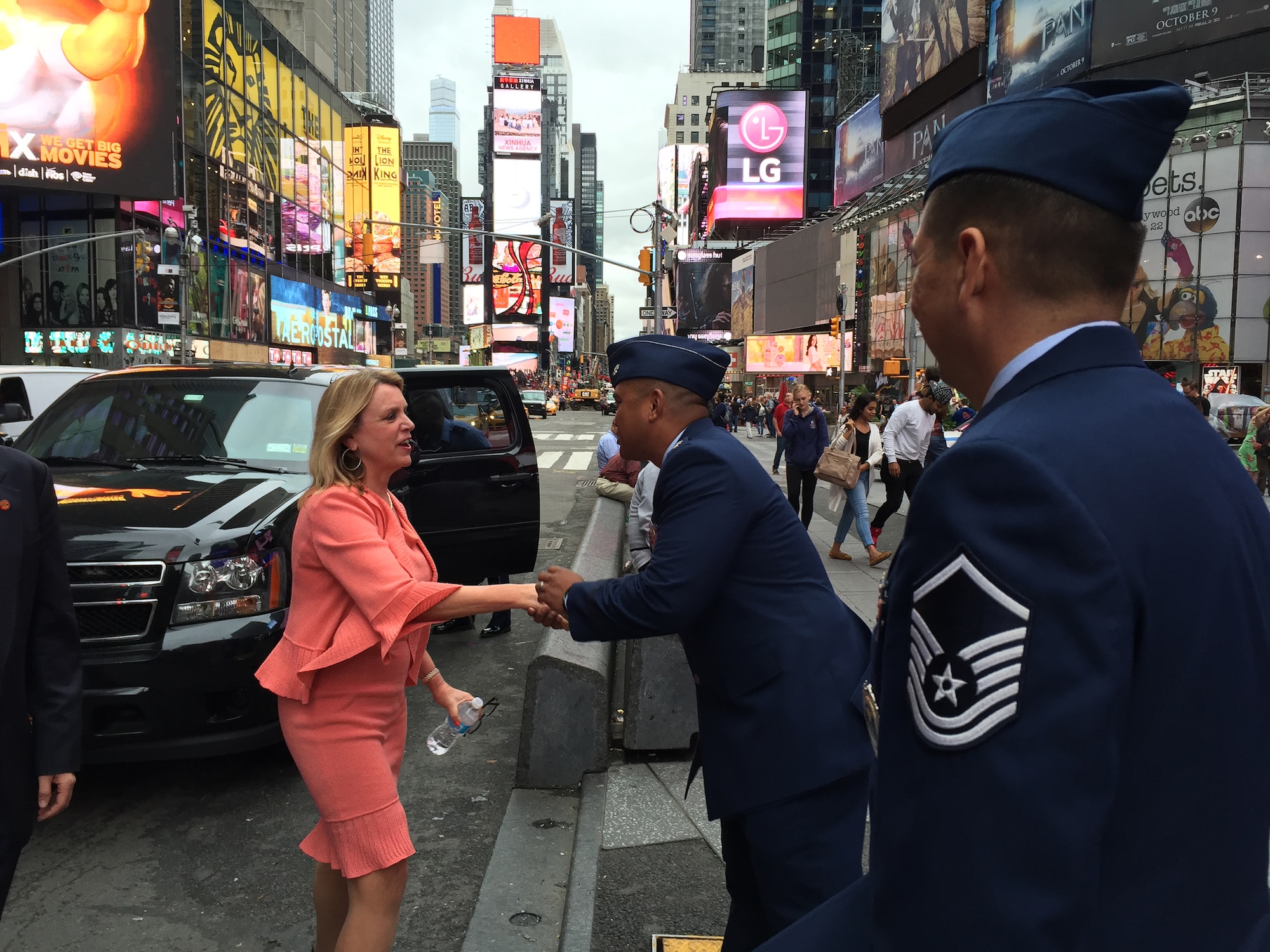 Lt. Col. Ray J. Fernandez, commander of the 313th Recruiting Squadron, greets Secretary of the Air Force Deborah Lee James as she arrives at the Times Square office in New York City Sept. 30, 2015. At right is Master Sgt. Omar Becerra. (U.S. Air Force photo/Master Sgt. Jennifer Lindsey)