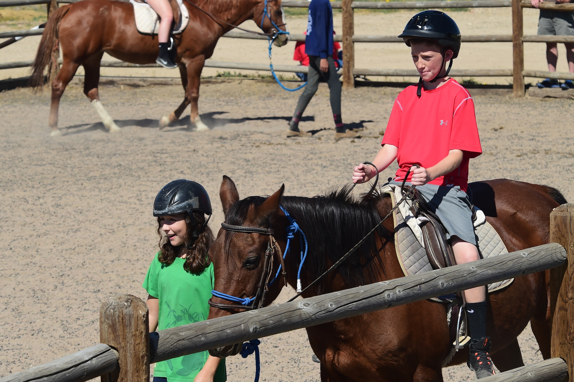 A child from Buckley Air Force Base rides a horse around a ring Sept. 26, 2015, at Urban Farm in Stapleton, Colo. Urban Farm hosted Buckley families, providing them with a tour of the farm as well as an opportunity to interact with the animals. (U.S. Air Force photo by Airman 1st Class Luke W. Nowakowski/Released)