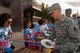 Staff Sgt. Talon Ferguson, an avionics technician with the 54th Maintenance Squadron, grabs a plate of free food at the annual Thanks Team Holloman event at Holloman Air Force Base, Oct. 2. Free food, music and door prizes were provided by local community members to show appreciation for Team Holloman. (U.S. Air Force photo by Airman 1st Class Randahl J. Jenson)