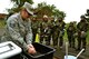 Staff Sgt. Alisa Garza, 111th Attack Wing’s base civil engineering squadron emergency manager, explains decontamination techniques and entry and exit into various zones during Chemical, Biological, Radiological, Nuclear and Explosives survival training Oct. 3, 2015, at Horsham Air Guard Station, Pennsylvania. Garza demonstrated the procedures to Guardsmen donning their Mission Oriented Protective Posture gear who had just finished training with the M-50 joint service general purpose mask. (U.S. Air Force photo by Tech. Sgt. Andria Allmond/Released)