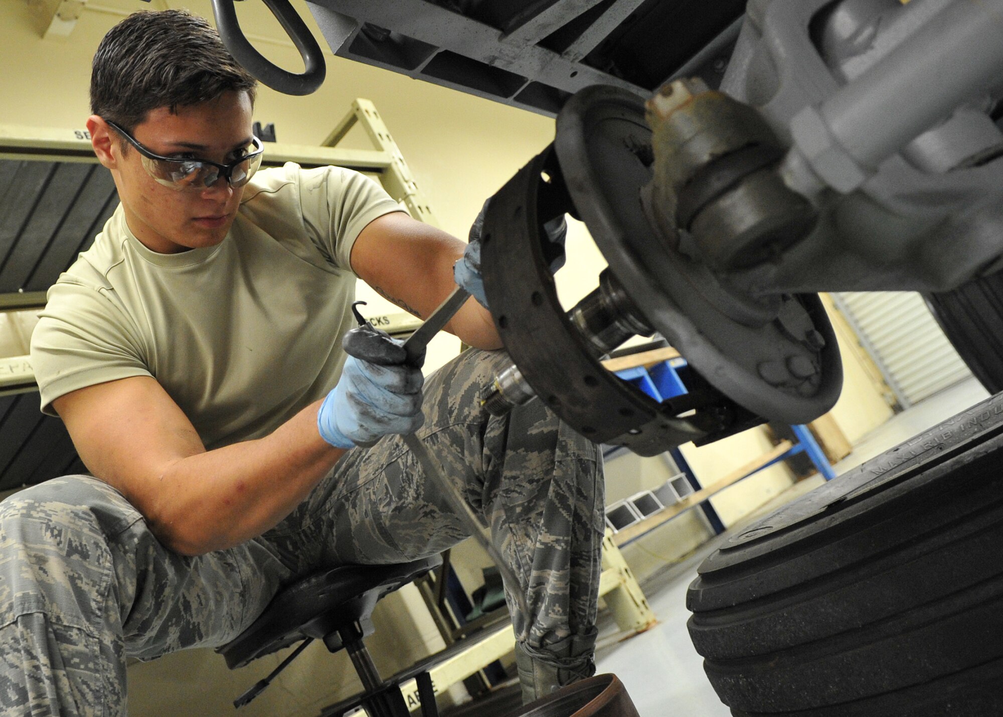Airman 1st Class Ace Ragle, 325th Maintenance Squadron munitions support equipment maintenance crew chief, disassembles a platform brake Oct. 2. Ammo Airmen duties include providing munitions and munitions equipment to aircraft on base. (U.S. Air Force photo by Senior Airman Ty-Rico Lea/Released)