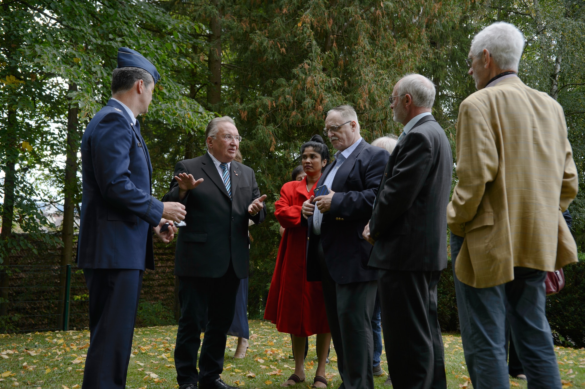 Hubert Burkard, Dietingen mayor emeritus, center, describes the burial location of 2nd Lt. Priesley Cooper Jr. Sept. 25, 2015, at Dietingen, Germany. Cooper was a World War II U.S. Army Air Forces pilot that was shot down near the town. Dietingen and Air Force members came together to honor Cooper and return his belongings to his relatives during a memorial ceremony. (U.S. Air Force photo/Staff Sgt. Armando A. Schwier-Morales) 