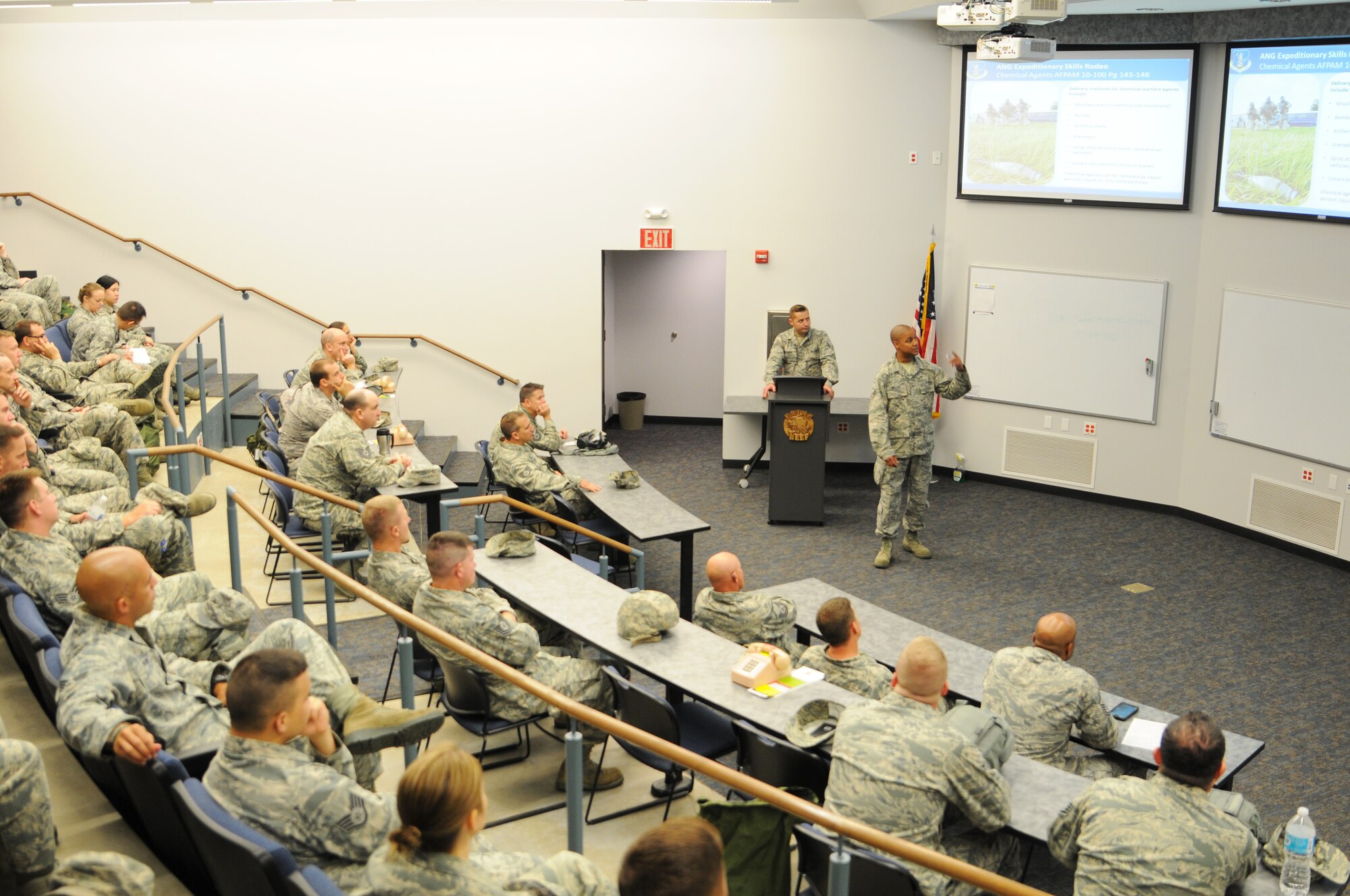 Senior Airman Keenan Wallace, 188th Civil Engineer Squadron emergency manager, and Senior Airman James McFerron, 188th CES emergency manager, instruct Expeditionary Skills Rodeo trainees Sept. 20, 2015, on the importance of chemical, biological, radiological and nuclear safety at Ebbing Air National Guard Base, Fort Smith, Ark. The ESR is a course designed to instruct Airmen on CBRN safety and self-aid buddy care techniques. (U.S. Air National Guard photo by Senior Airman Cody Martin/Released)
